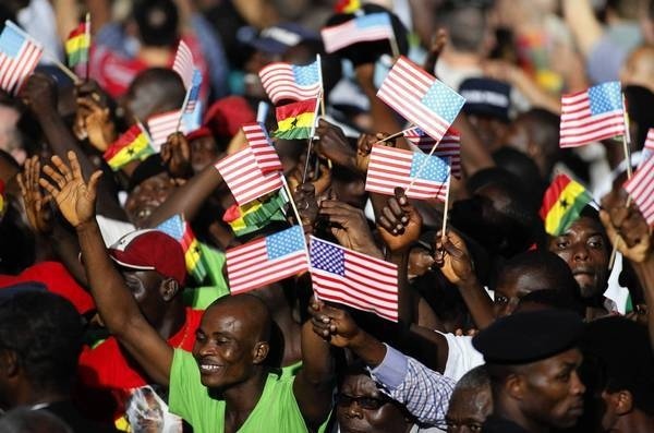 People in Accra, Ghana, cheer during a departure ceremony for President Obama after his visit in July 2009. (Rebecca Blackwell, Associated Press / July 11, 2009)
