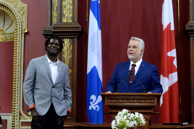 © Photo gracieuseté - Roch Théroux Boucar Diouf en compagnie du Premier ministre du Québec, Philippe Couillard