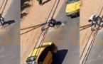 Un chauffeur de taxi achète du ciment pour combler un trou sur la route 