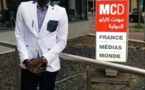 Pape Diouf devant les locaux de France médias monde 