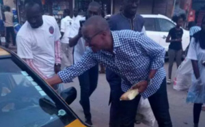 Abdoul Mbaye dans les rues de Dakar servant du " Ndogou " aux automobilistes et passants ( images )