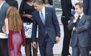 Barack OBAMA  regarde quoi? "Rire"
